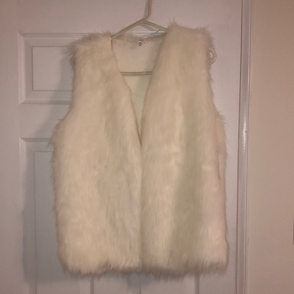 White fur vest
